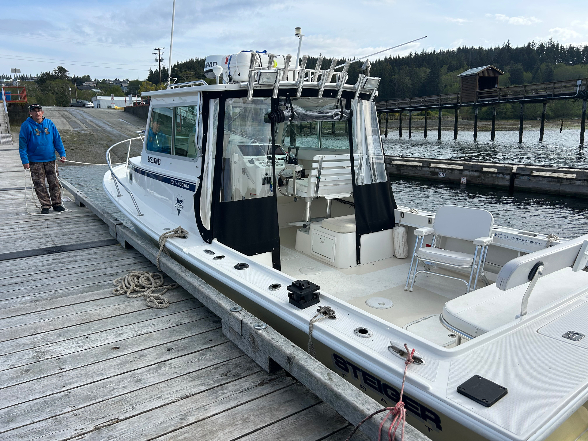 28-foot Steigercraft sport fishing charter boat at dock in Winter Harbour, BC